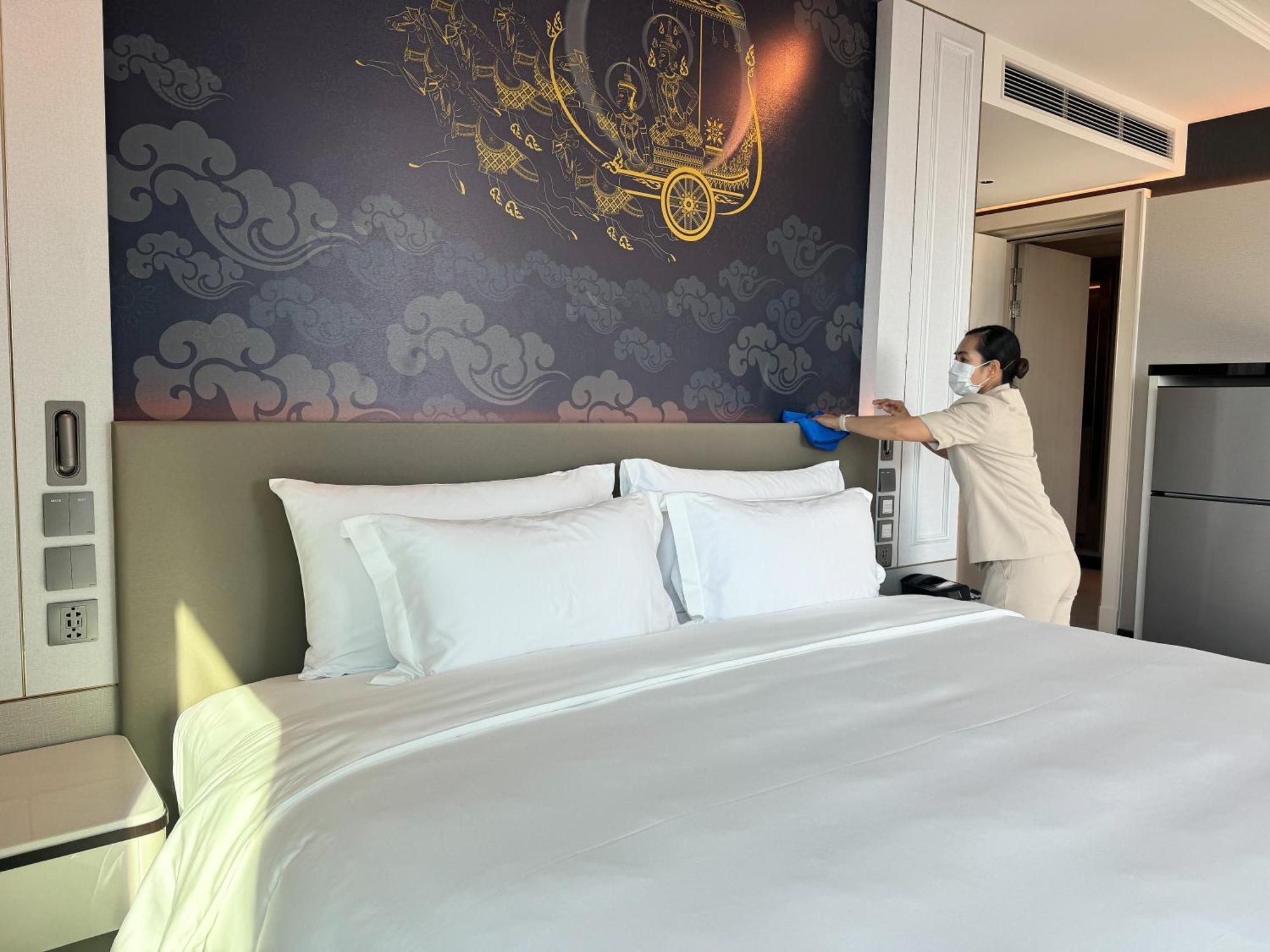 Grande Centre Point Surawong Bangkok Hotel Exterior photo A hotel room being disinfected in Bangkok, Thailand
